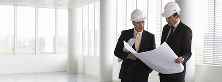 Two men with construction plan